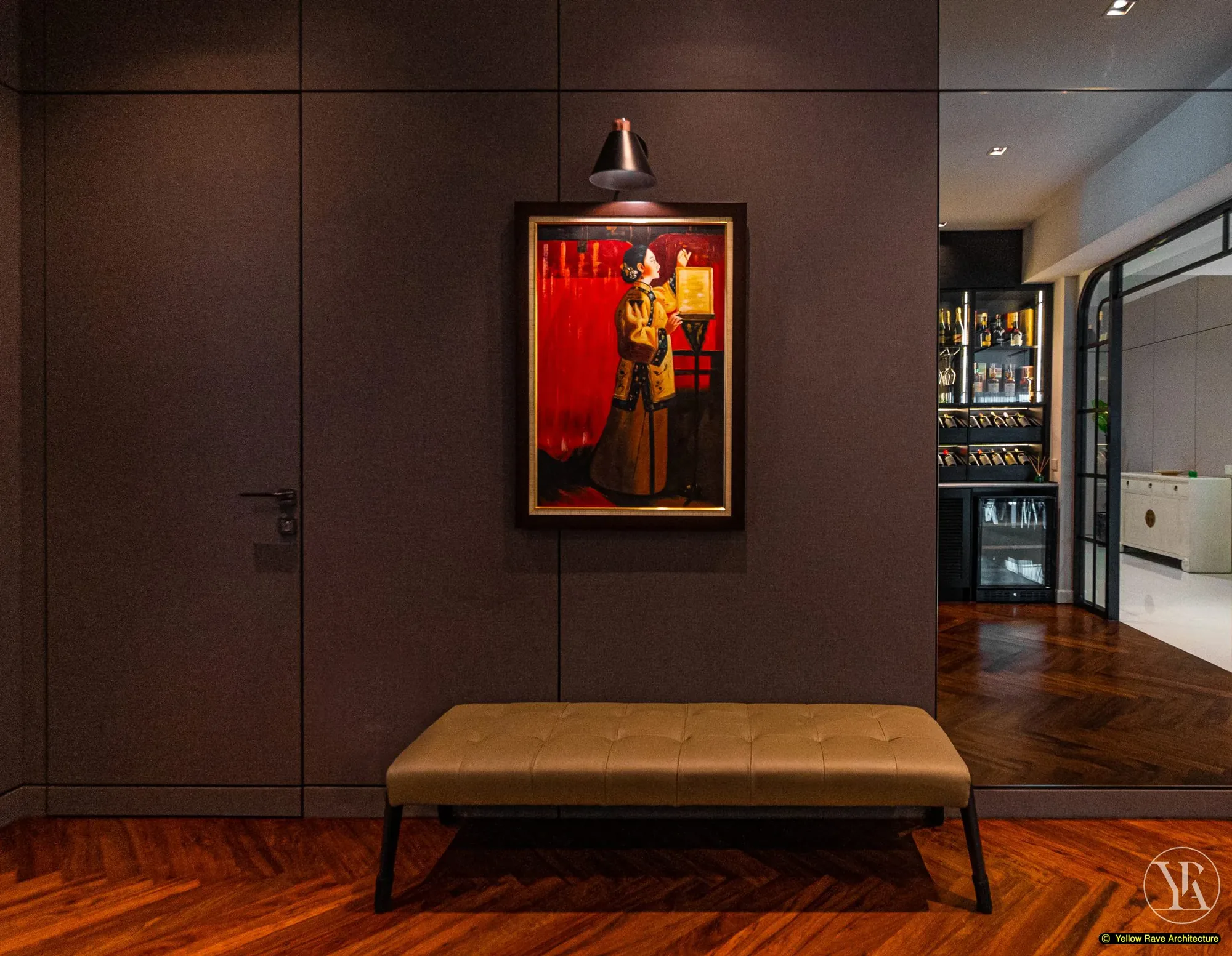 Down Time Drinks — close-up of brown tufted Chesterfield sofa back with Asian-style painting lit by black wall sconce