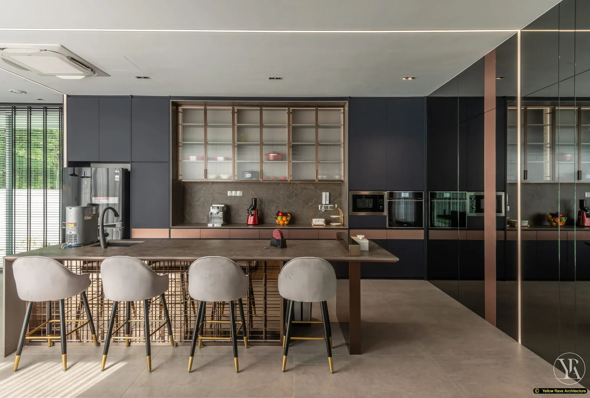 Soft Mirrored Kitchen — view from dining zone looking back toward the kitchen showing island, bar stools, navy cabinets and smoky mirror panel