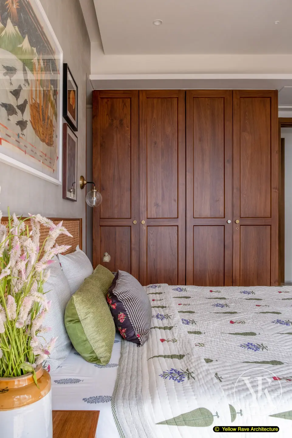 Contemporary Vintage — bedroom close-up showing floral block-print wallpaper and green upholstered bed frame detail