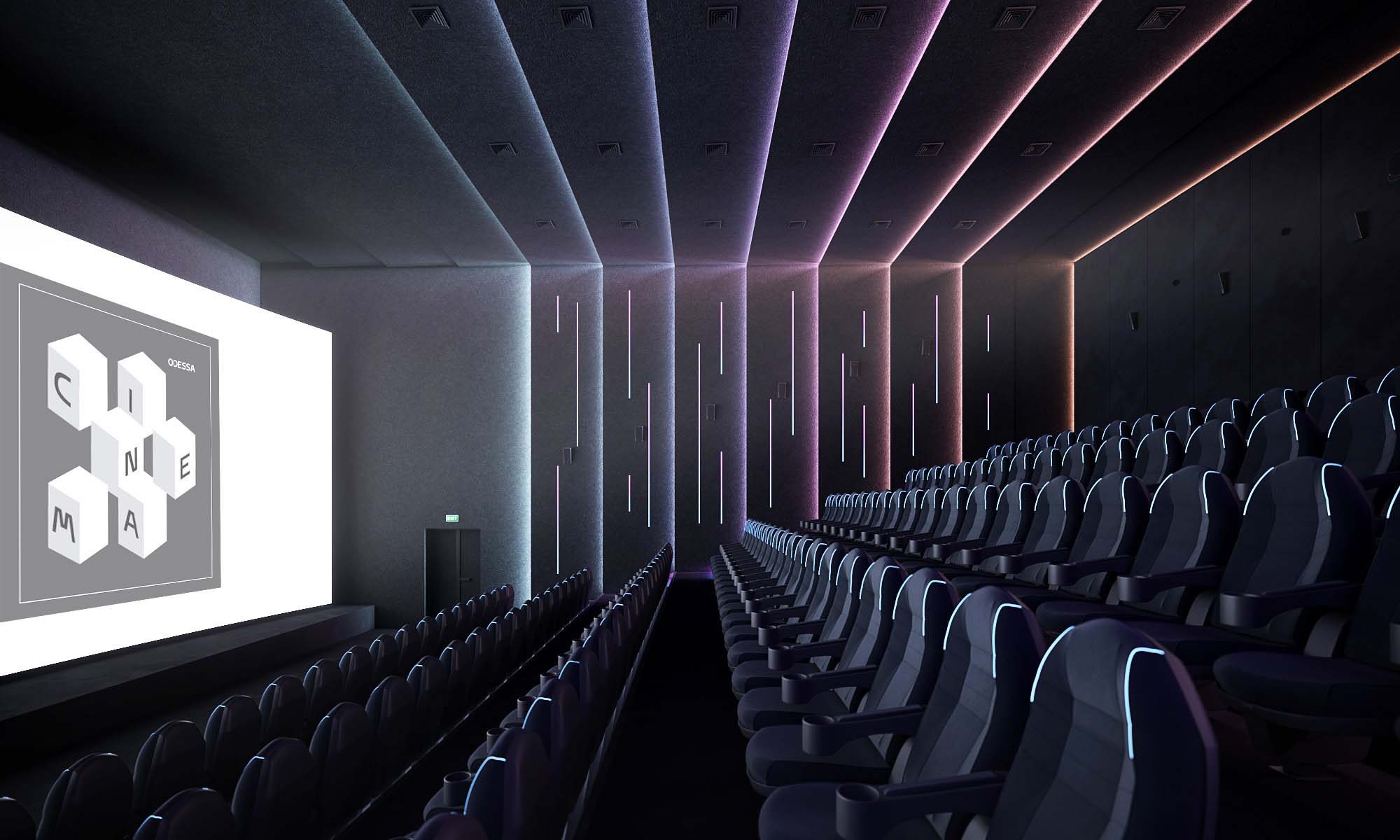 Cinema — bird's-eye view of curved grey velvet sofa seating pods with illuminated aisle stairs