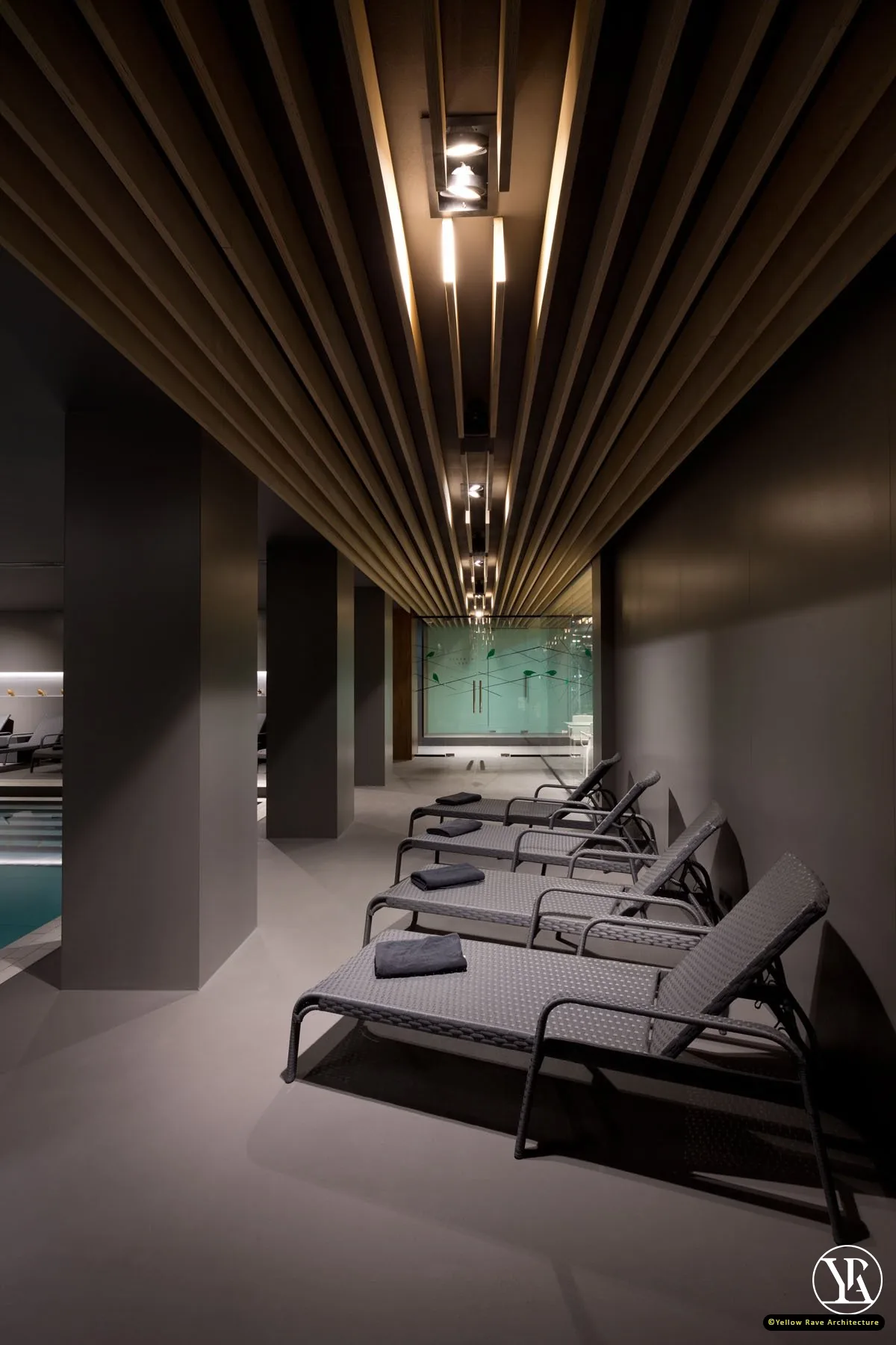 Home Spa Extension — main adult indoor pool with dark ceiling, LED cove perimeter lighting, timber column and stepped deck with lounge chairs