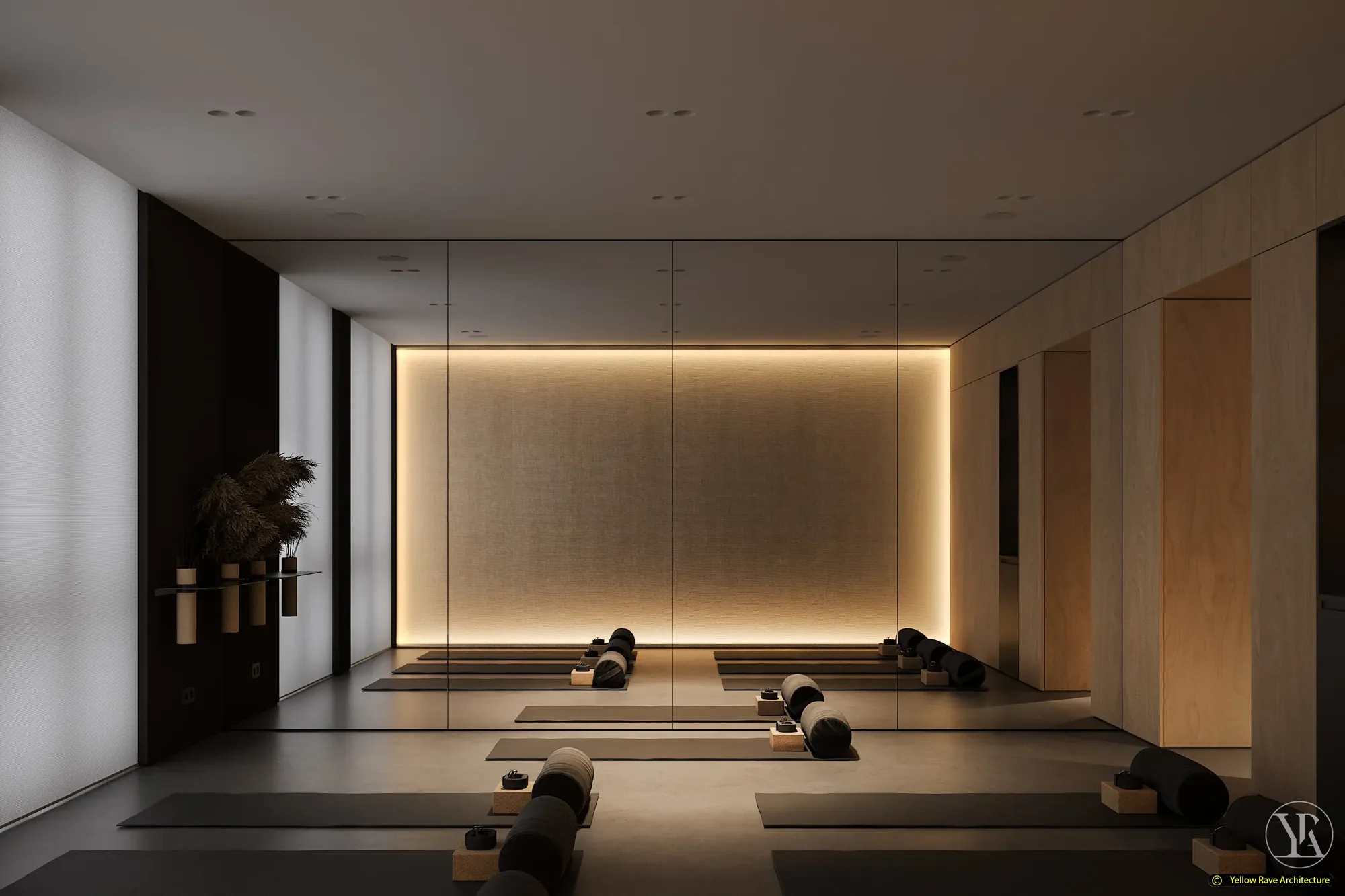 Yoga with Friends — practice room view from rear showing backlit linen focal wall, mirror wall to the left and grey mats laid in two rows