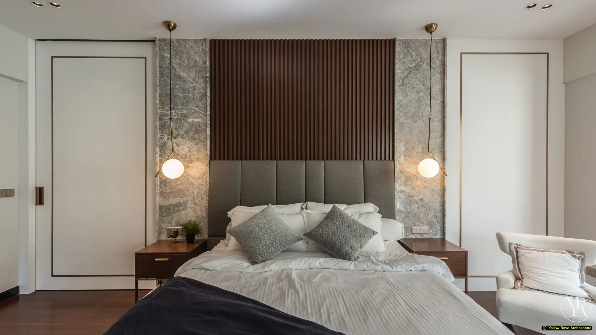 Pristine Walk-in Closet — master bedroom from foot of bed showing white panel wardrobe entry door to the right and wall-mounted TV above floating walnut media unit with marble shelf