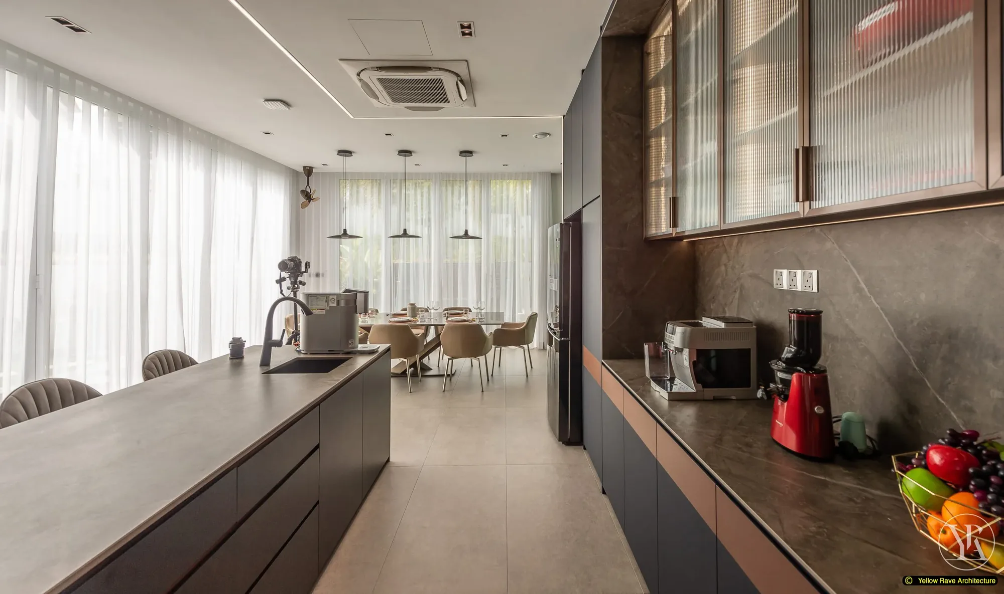 Soft Mirrored Kitchen — close-up of bronze-framed reeded glass upper display cabinets against navy base cabinets, dark grey stone backsplash and countertop with appliances