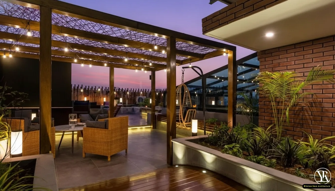 Rooftop Terrace — open terrace at dusk with timber pergola, string lights, rattan seating, red swing frame and stepping-stone lawn path