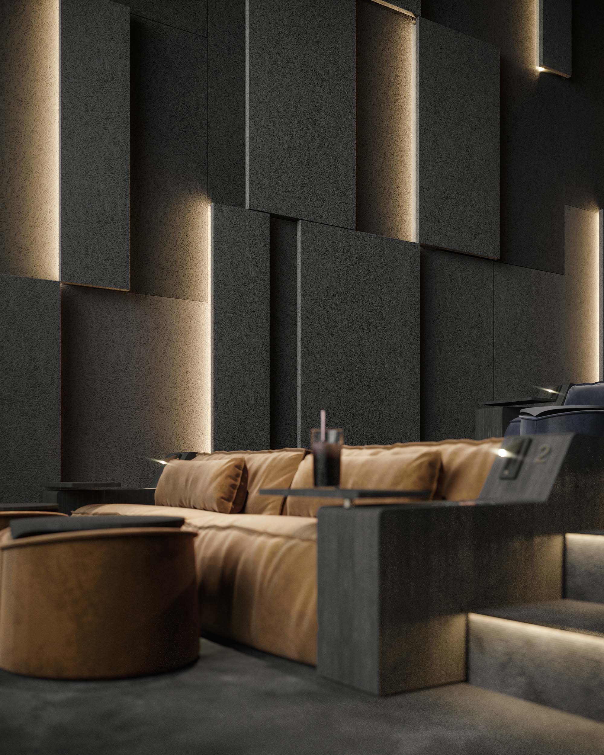 Cinema — main auditorium showing grey velvet recliner seating, curved acoustic walls and projection screen with film