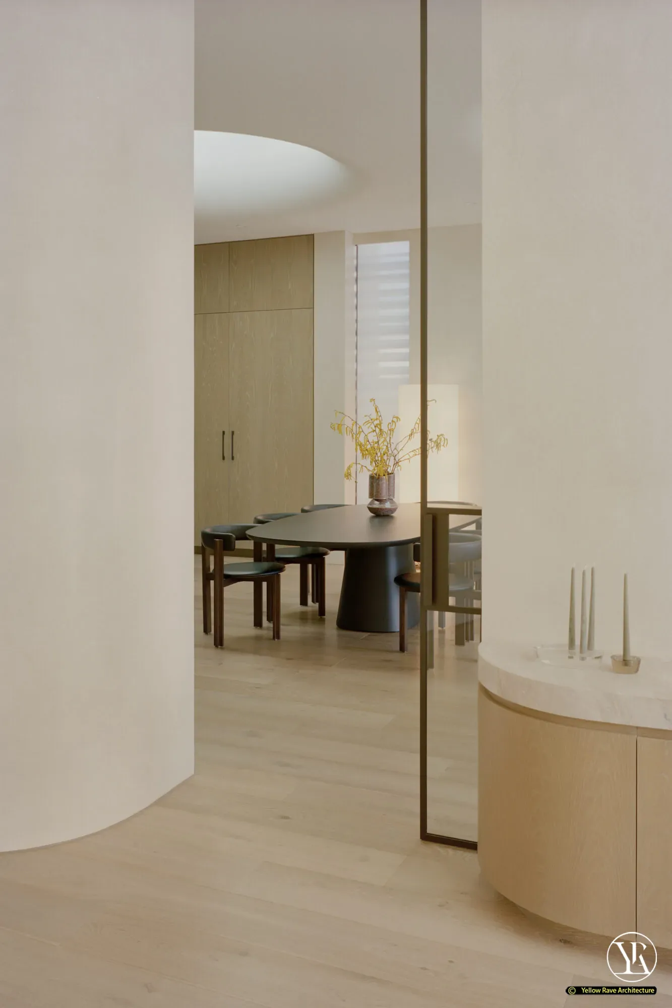 House of Privacy Walls — living room with recessed fireplace, grey modular sofa, black leather armchairs and full-height glazing to the garden