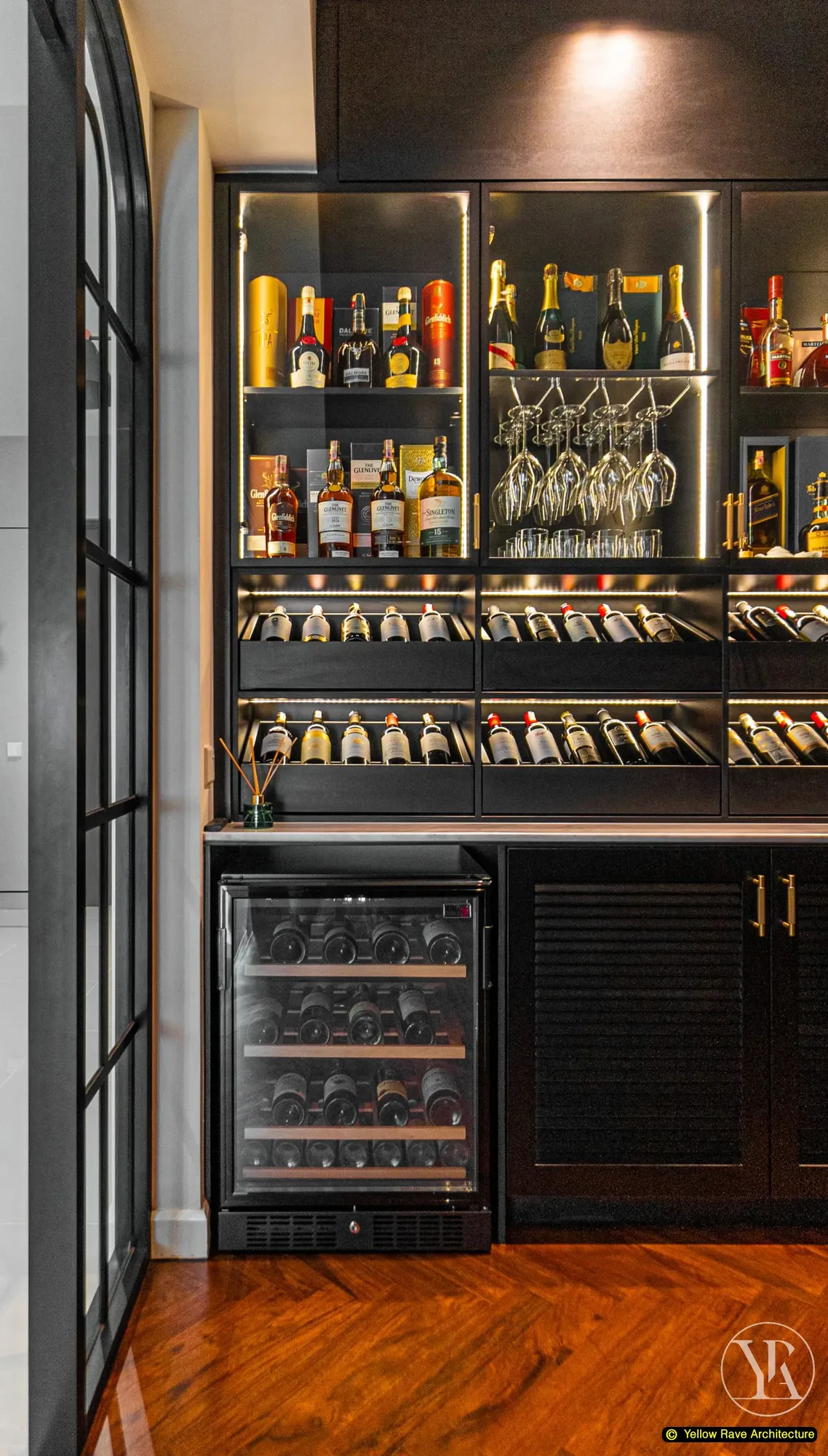 Down Time Drinks — large figurative oil painting of a woman in robes on the dark wall with bar cabinet visible through the opening beyond