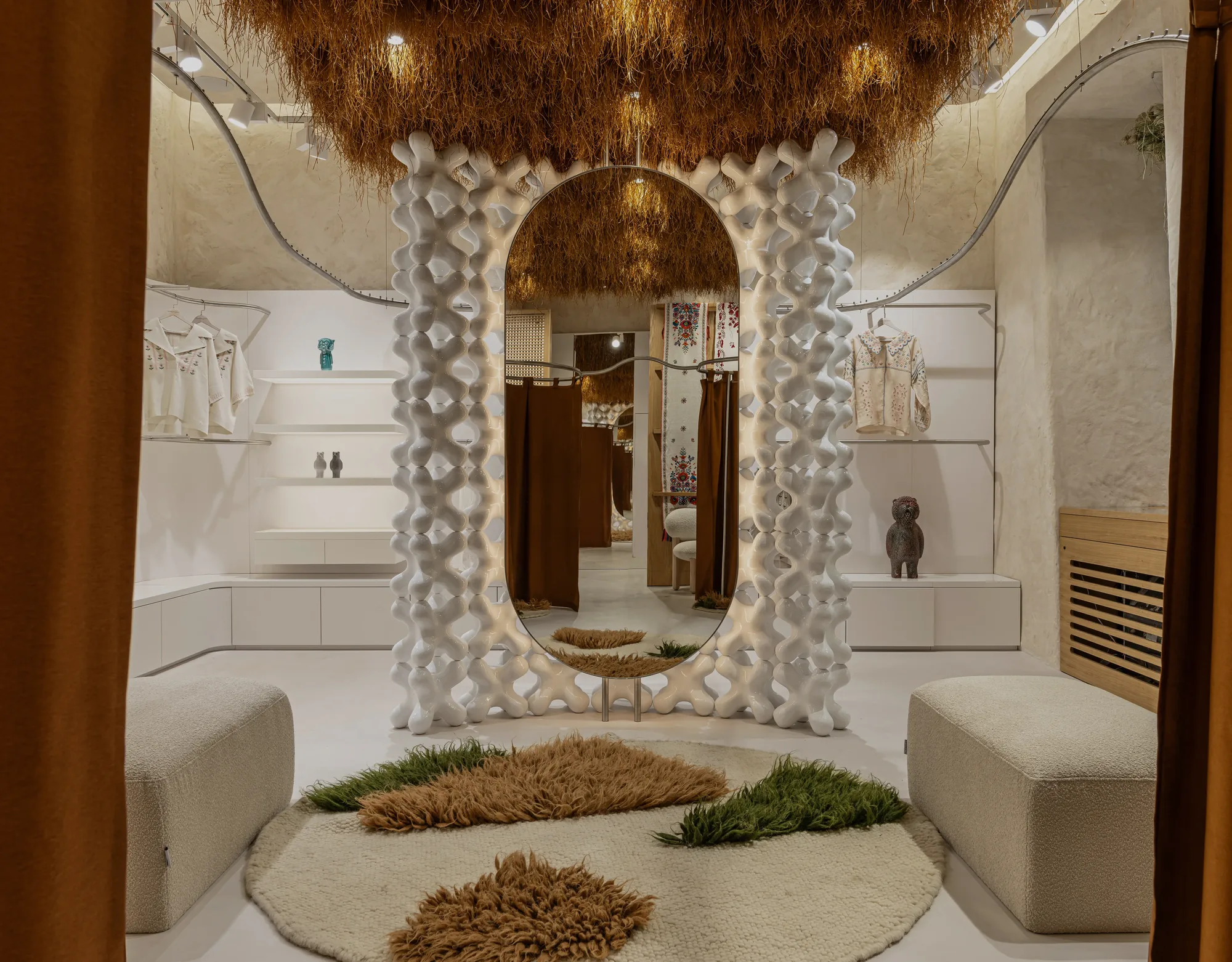 Miko Heritage Boutique — central fitting space with organic rug arrangement and boucle seating
