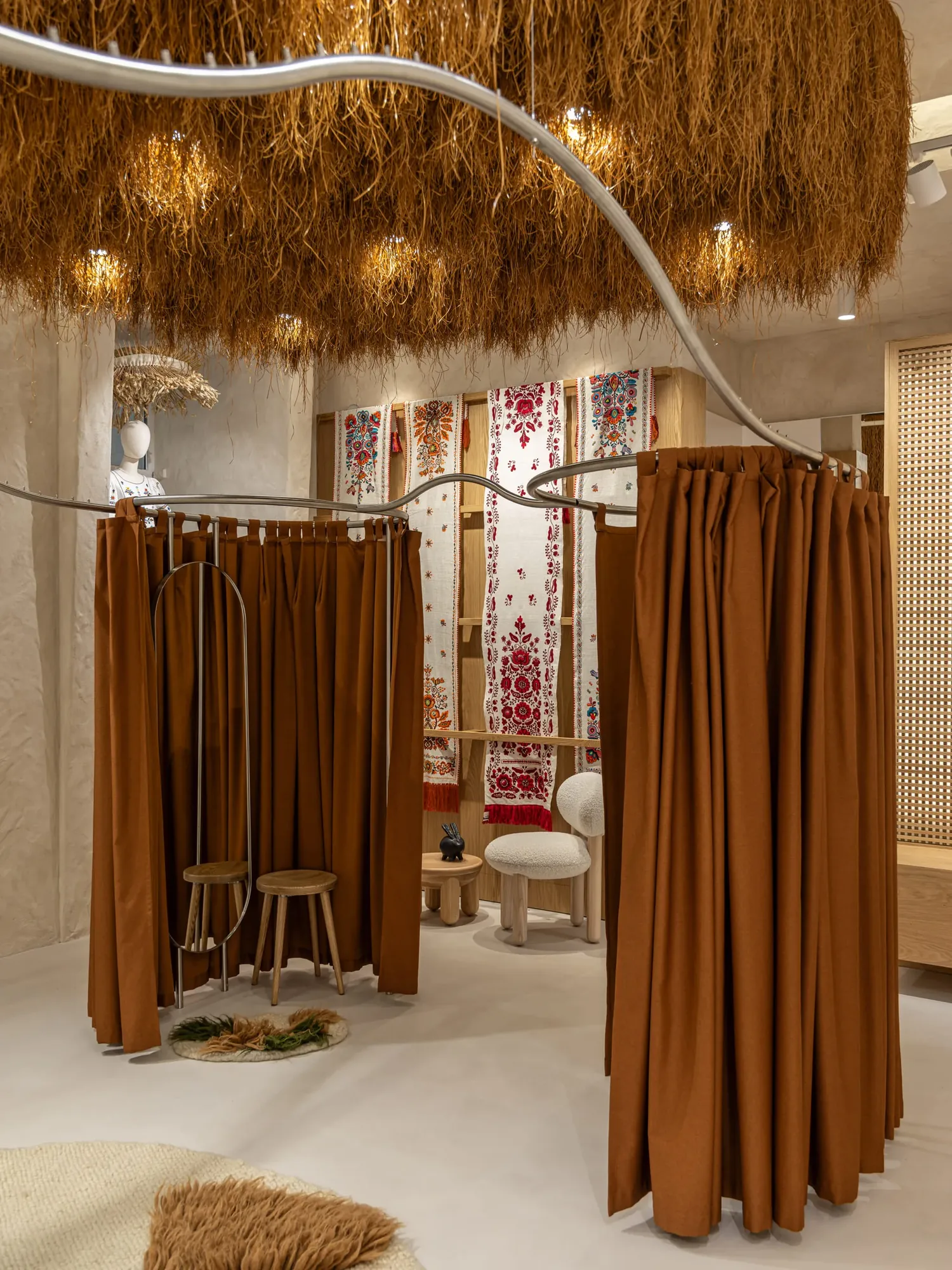 Miko Heritage Boutique — reclaimed timber columns and steel shelving with heritage textile display