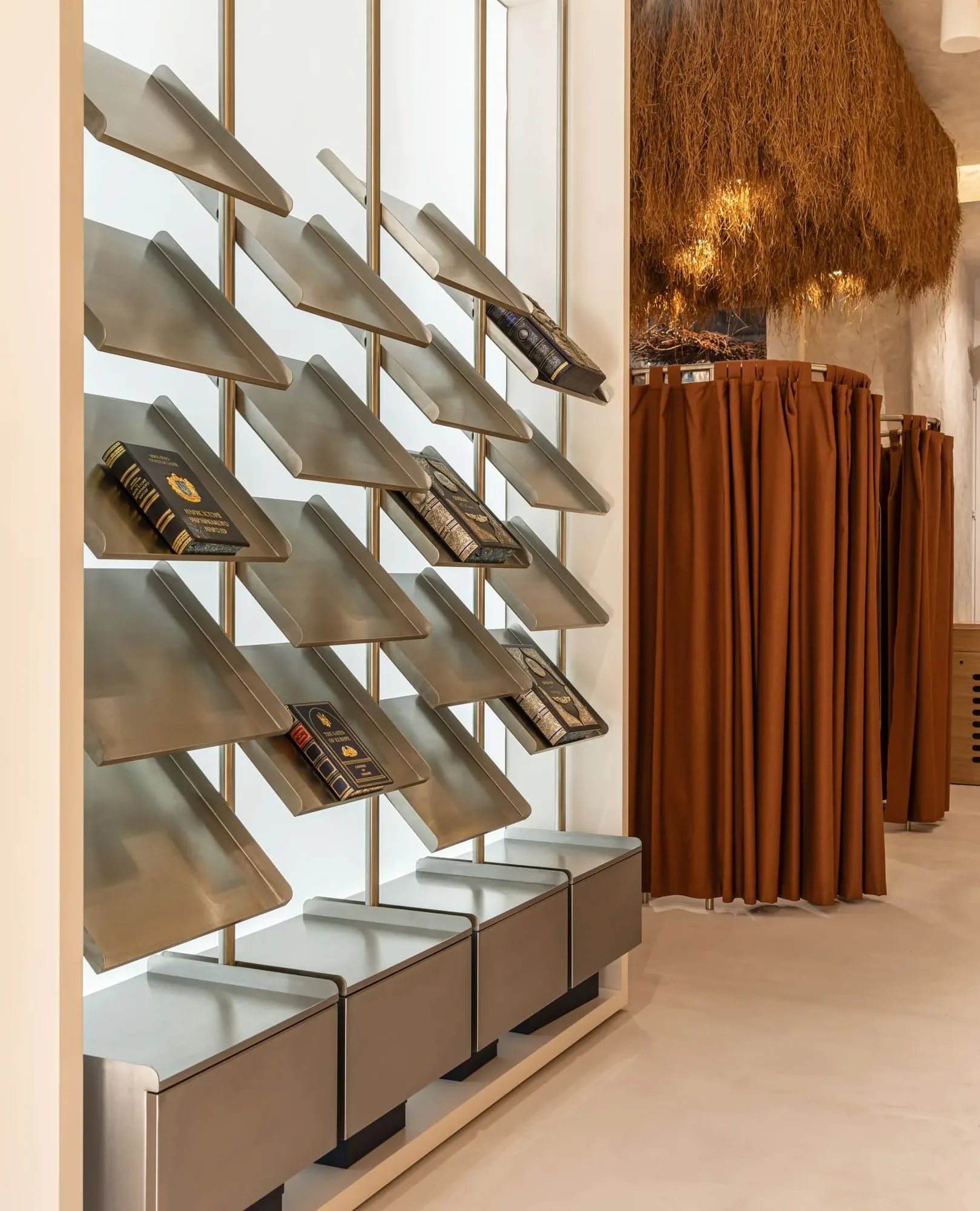 Miko Heritage Boutique — polished concrete floor with organic rug arrangement and artefact display