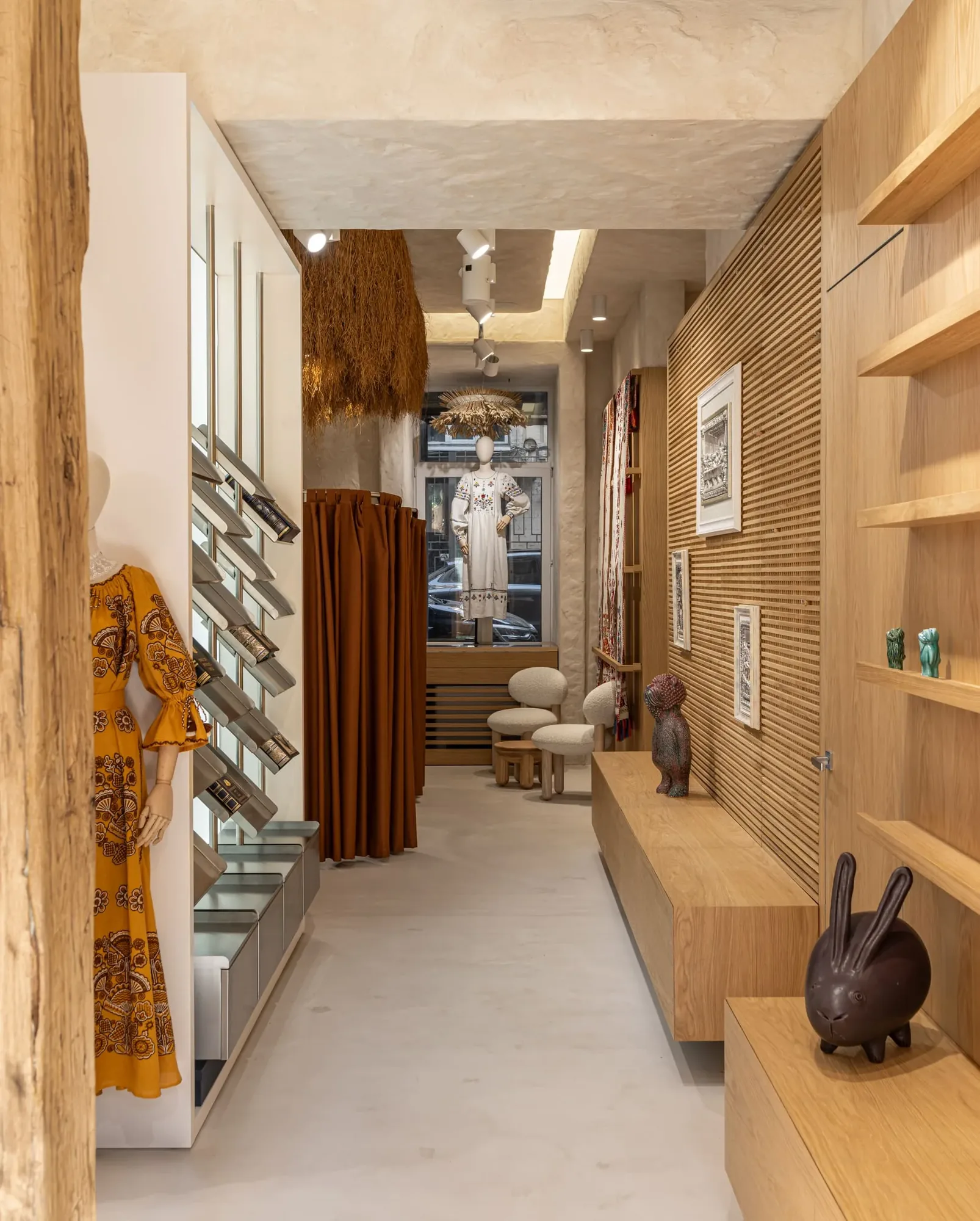 Miko Heritage Boutique — detail of boucle seating and woven basket display on steel shelving
