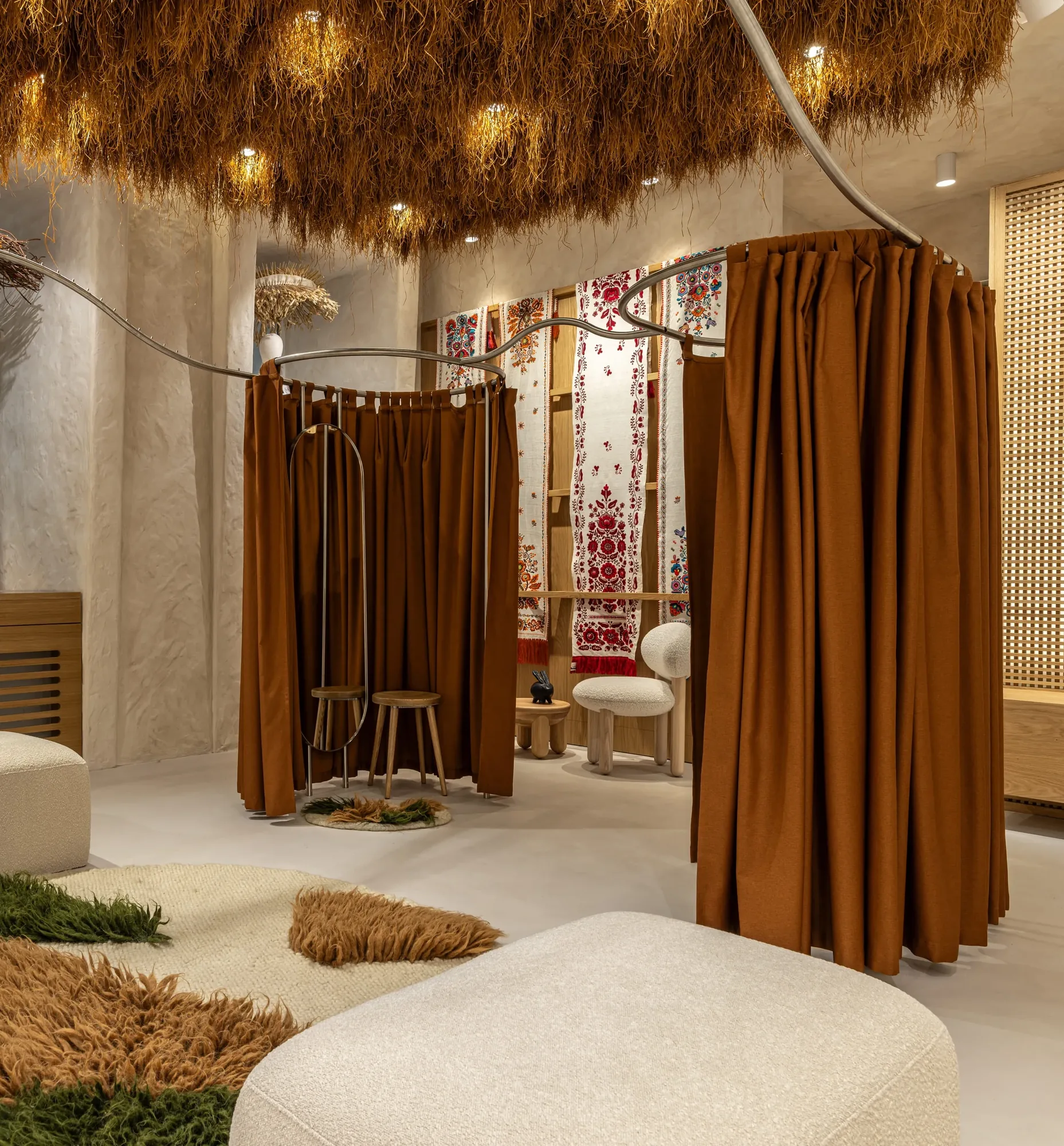Miko Heritage Boutique — overview of the fitting area with ceramic lattice mirror and floor rug