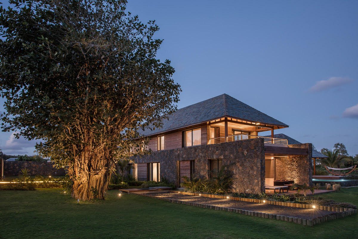 Serenity Abode — volcanic stone base walls and timber cladding of the first pavilion, Manda Island